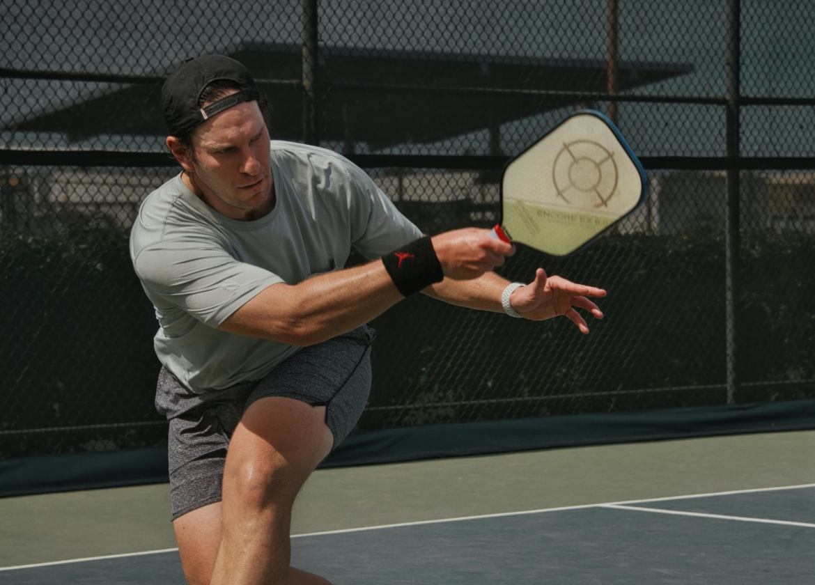 Athlete playing pickleball outside